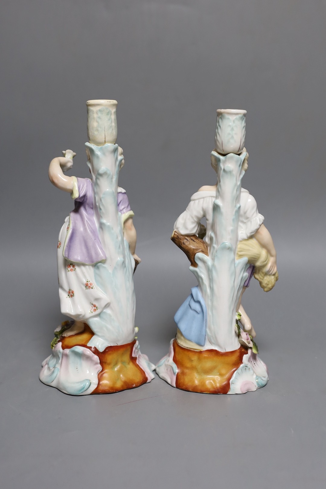 A pair of 19th-century Sitzendorf porcelain candlestick figures